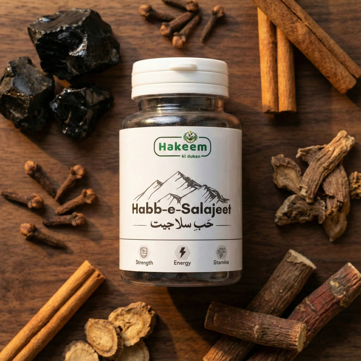 Bottle of Hakeem Habb-e-Salajeet with spices on a wooden surface