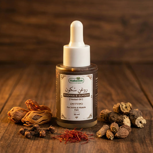 Bottle of Roghan-E-Sukoon herbal oil with dried herbs on a wooden surface